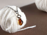 Кулон з чорненим сріблом і бурштином «Змійка»