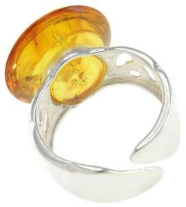Разомкнутое кольцо с жёлтым камнем