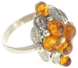 Срібний перстень з бурштиновими вставками медового кольору