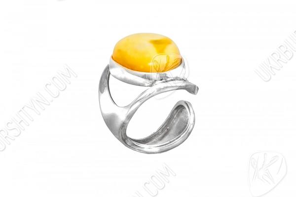 Разомкнутое кольцо с желтым камнем