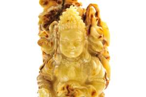 Бурштиновий камінь з різьбленням «Будда»